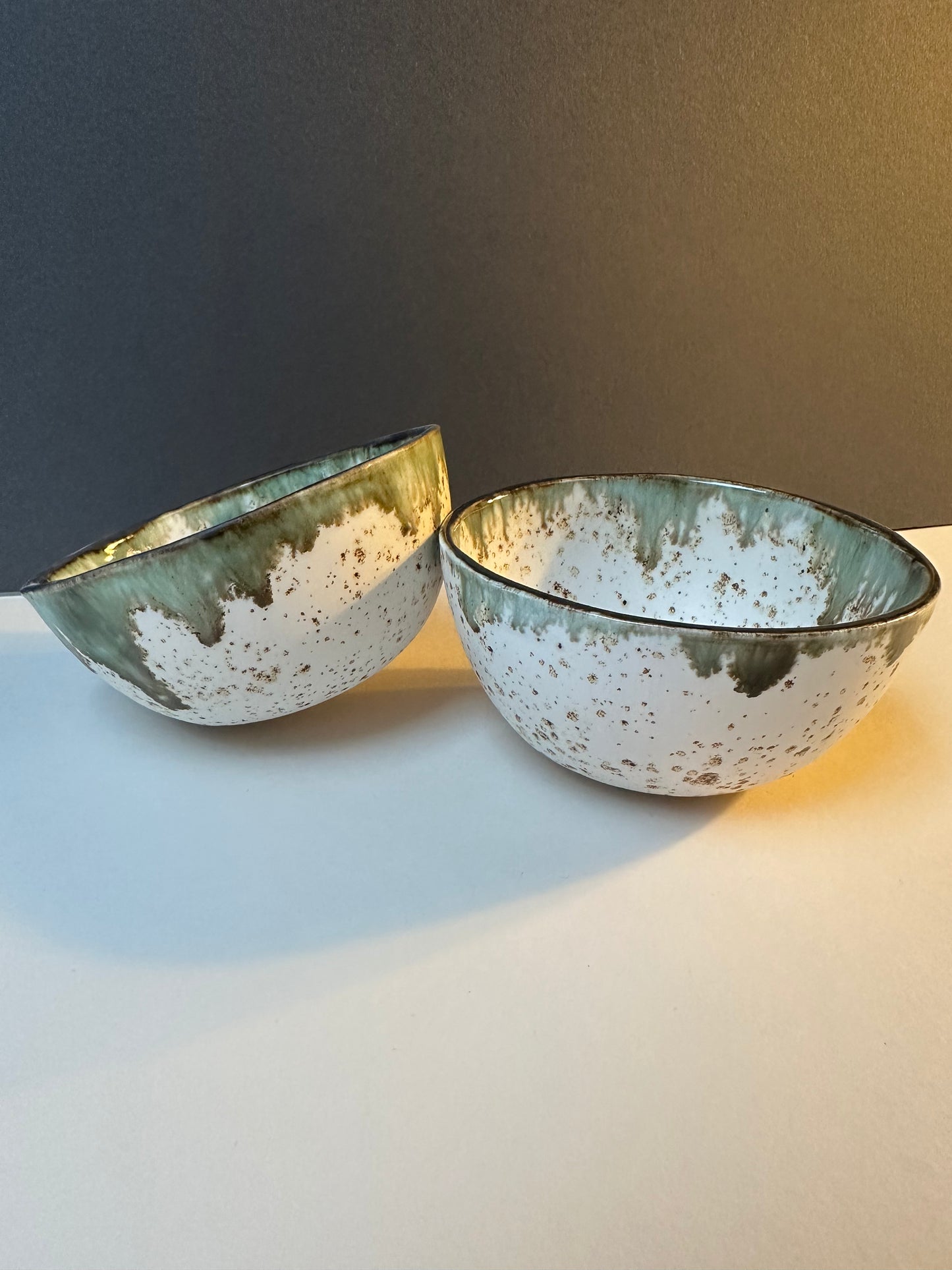 Small earthenware bowl, speckled white with lustre